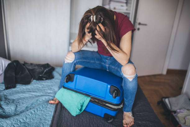 istock Stress woman and suitcase 1150134291