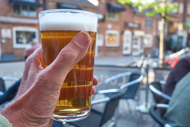 istock holding glass of beer 1150134614