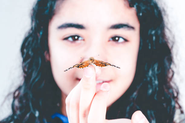 istock girl and beautiful butterfly 1150134645