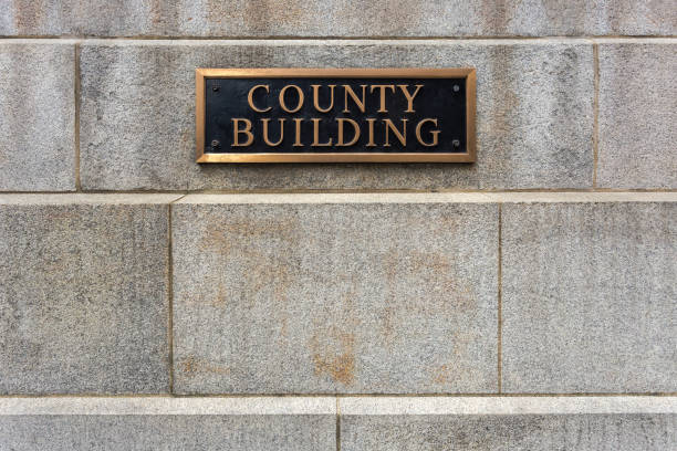 istock Generic county building sign on concrete block building 1150134661