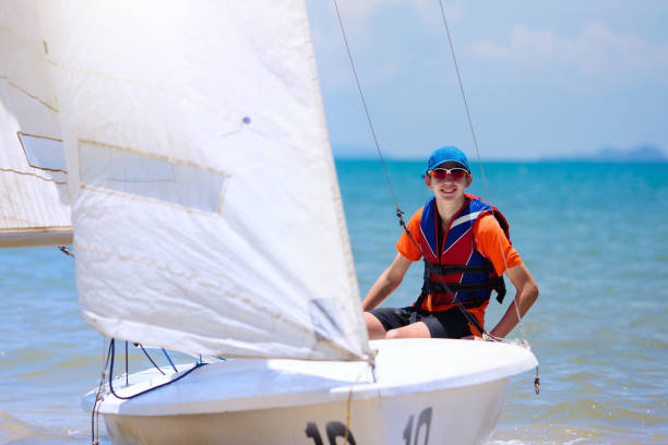 Racing sailboats 29-er in a race. Carrying  blue spinnaker. Please visit  My Sailing collection 