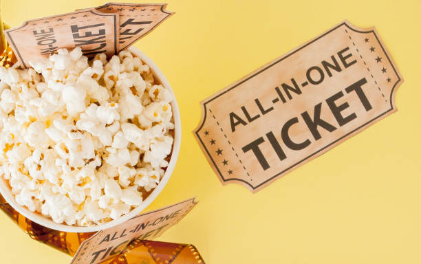 istock Movie tickets, film strips and popcorn on blue background. Copy space for text 1150135497