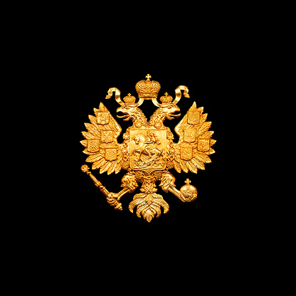 Gold double eagle isolated on black background. Russian coat of arms