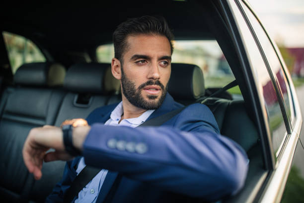 istock Handsome businessman driving in a car 1150136652