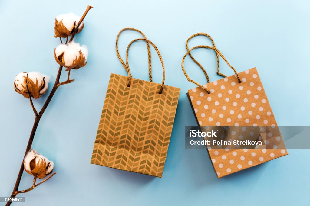Craft Bags For Gifts And Purchases Flatlay On The Blue Background Recycled  Package Summer Sale Stock Photo - Download Image Now - iStock