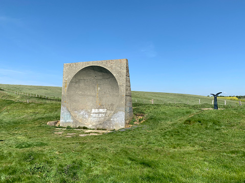 A concrete parabola known as an accoustic mirror mounted on the White Cliffs of Dover.  Used during World War 2 to amplify the sound of approaching enemy aircraft.