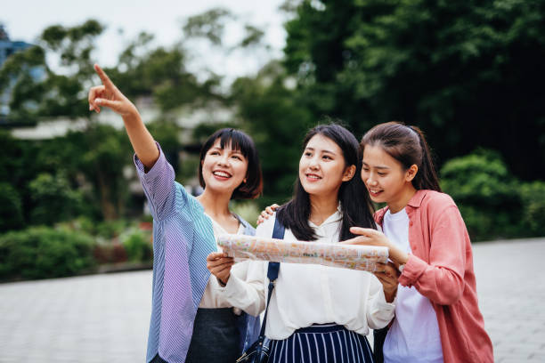 istock Young Taiwanese women looking at map during city break. 1150151275