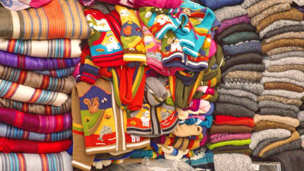 istock Piles of sweaters and children's jackets 1150151739