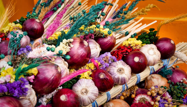 istock Garlic and red onions decorated with straw flowers 1150154376