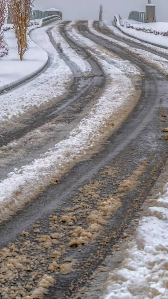 istock Vertical Tracks on a snowy road in Daybreak during winter 1150156405