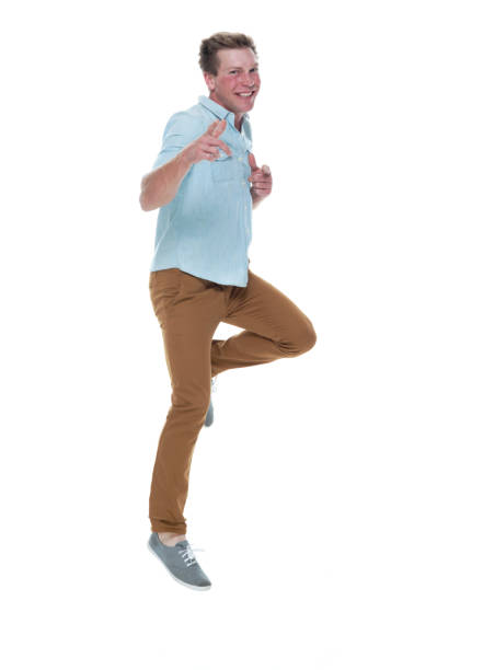 istock Casual well dressed man jumping 1150164885