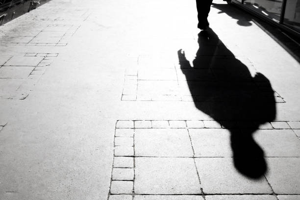 istock Blurry shadow silhouette of  a person walking 1150165665