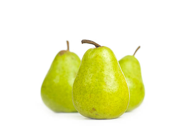 Three Isolated Pears On White  bartlett pear stock pictures, royalty-free photos & images