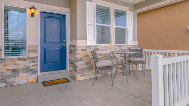 istock Clear Panorama Home exterior with a blue front door and reflective glass windows 1150167294