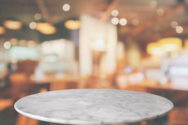 istock round marble table top with cafe restaurant bokeh lights abstract background for montage product display 1150170439