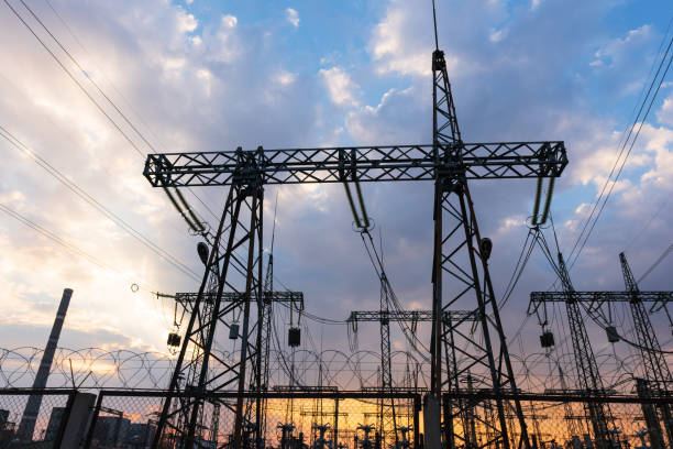 istock high-voltage power lines at sunset. electricity distribution station . 1150170706