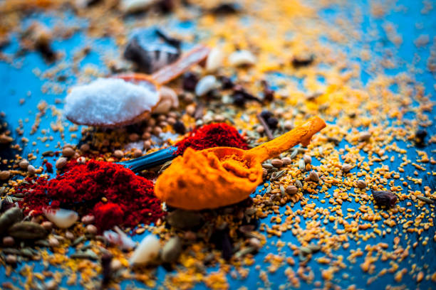 istock Ingredients to make mango pickle or aam ka achar or keri ka achar on black colored shiny surface. 1150170998