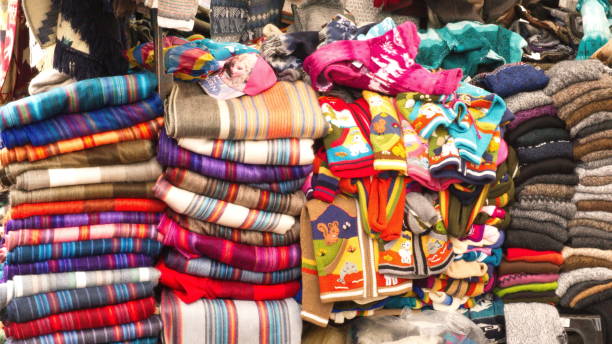 istock Piles of sweaters and children's jackets and blankets 1150172088