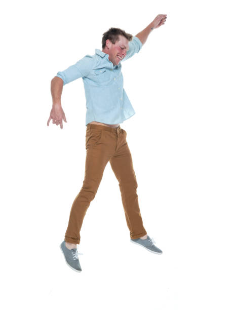 istock Casual well dressed man jumping 1150172347