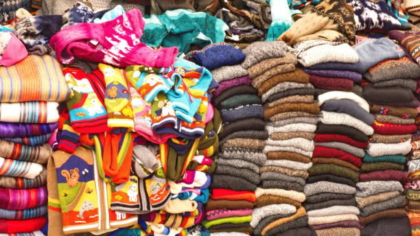 istock Piles of sweaters and children's jackets 1150180514