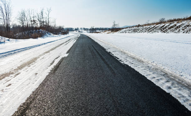 istock Highway through the field in winter 1150192863