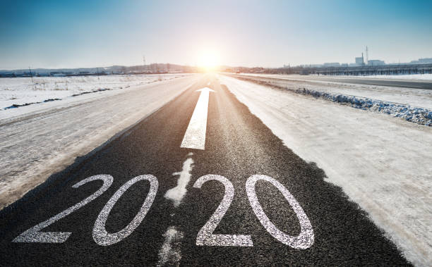 istock Number 2020 on winter asphalt road 1150192882