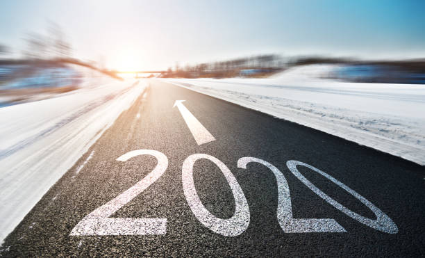 istock Number 2020 on winter asphalt road 1150192889