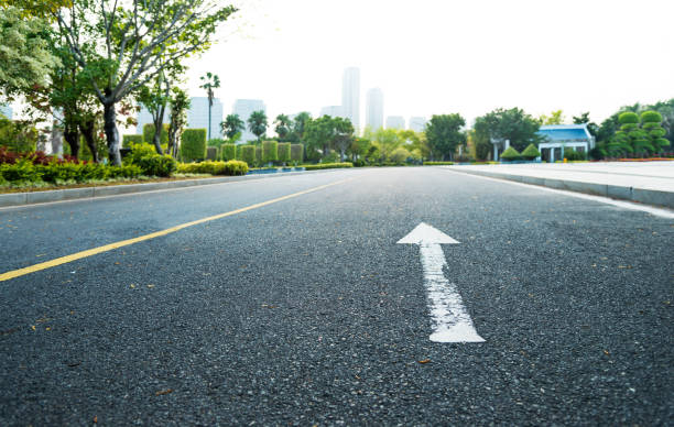 istock Asphalt highway with arrow sign 1150192943