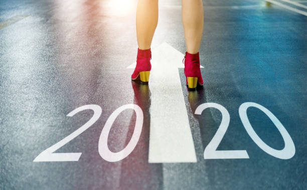 istock White arrow and Number 2020 on cement road 1150192957