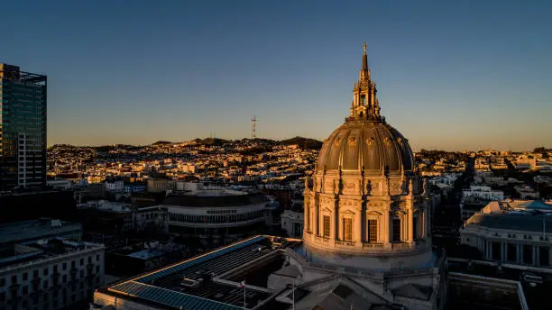 High quality stock aerial drone photo of the historic and beautiful San Francisco City Hall during daybreak.