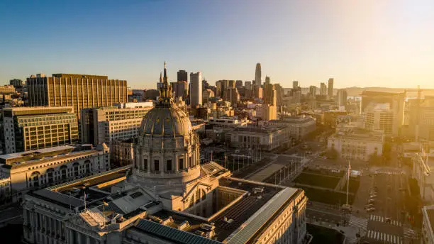 High quality stock aerial drone photo of the historic and beautiful San Francisco City Hall during daybreak.