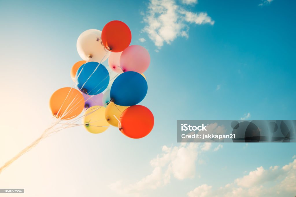 Vintage colorful balloon Colorful balloons done with a retro instagram filter effect. Concept of happy birth day in summer and wedding, honeymoon party use for background. Vintage color tone style Balloon Stock Photo