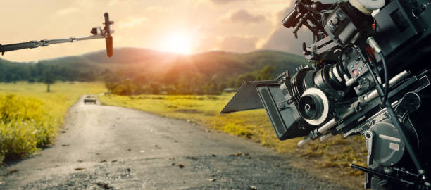 Behind the scenes of making a movie and TV commercial. Camera of movie and video production. Film Crew. B-roll, and crew team in outdoor nature background. Behind the scenes of making a movie and TV commercial. Camera of movie and video production. Film Crew. B-roll, and crew team in outdoor nature background. vista posterior stock pictures, royalty-free photos & images