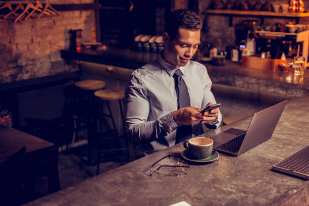 istock Freelancer texting his friend while waiting for him in the bar 1150202565