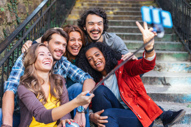 istock International friends taking selfie 1150206531