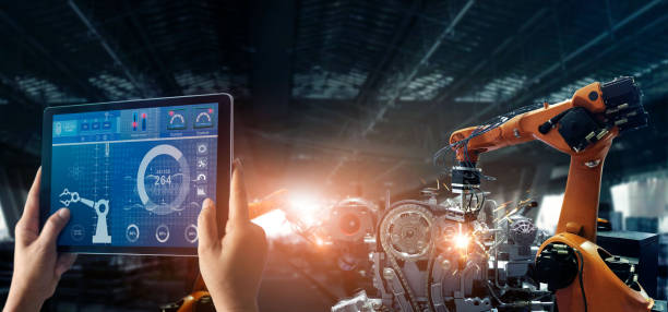 istock Engineer check and control welding robotics automatic arms machine in intelligent factory automotive industrial with monitoring system software. Digital manufacturing operation. Industry 4.0 1150208423