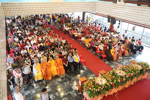 Kuala Lumpur, Malaysia - 19 May 2019: Buddhist devotees visit Wisma Buddhist at Old Klang Road to celebrate Wesak Day. Volunteers and visitors' schedules are packed with vegetarian meals preparation, flower offerings, candle lighting, Little Buddha bathing and prayers chanting.