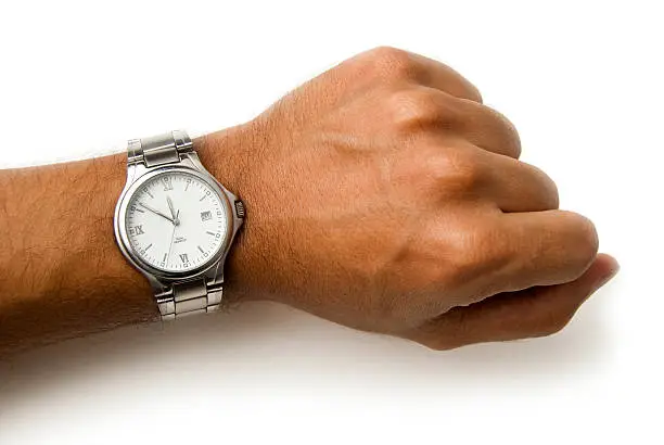 Photo of Wristwatch on a wrist - clipping path