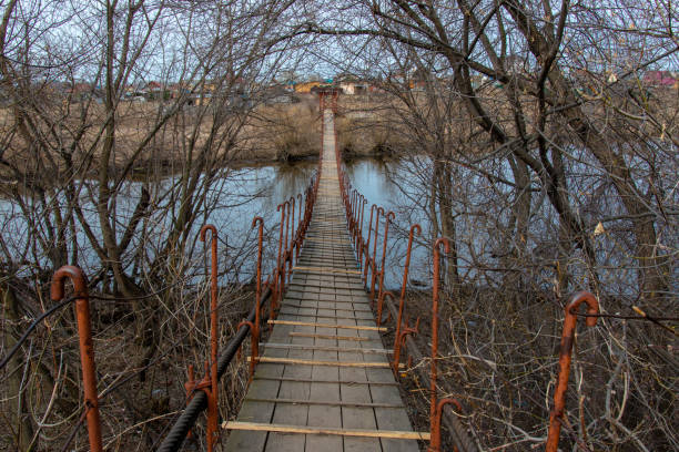 istock pedestrian bridge to cross the river 1150214897