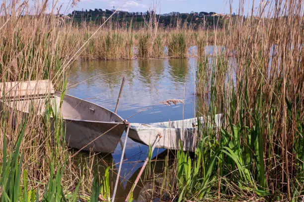 Montepulciano, Italy. 04-19-2019. Fishing  boat at lago di Montepulciano. nature reserve. Tuscany. Italy