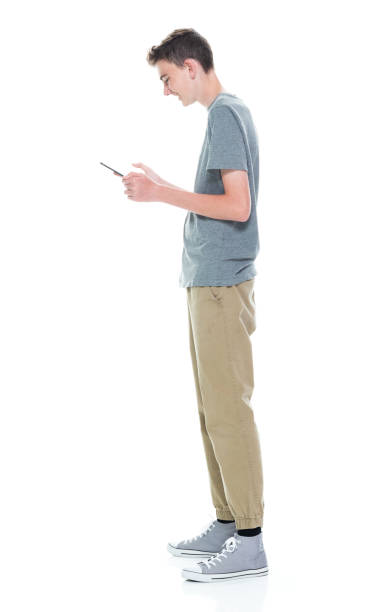 istock Young 13 year old teenage male - using tablet 1150216933