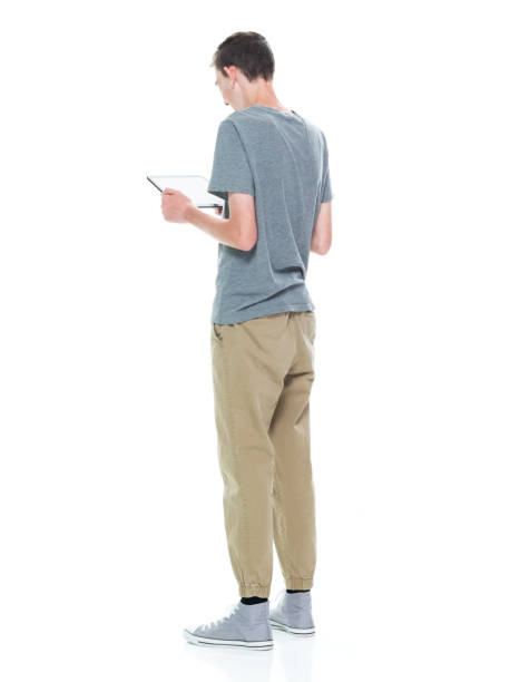 istock Young 13 year old teenage male - using tablet 1150216951