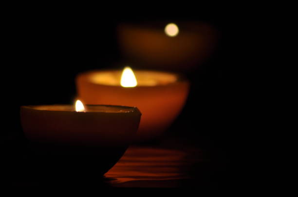 istock Lamp, candle shining in the darkness. Challis flame. Artistic composition. Lighting. 1150221671