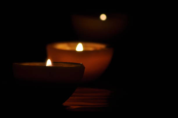 istock Lamp, candle shining in the darkness. Challis flame. Artistic composition. Lighting. 1150221835