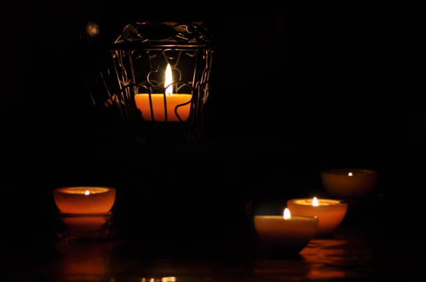 istock Lamp, candle shining in the darkness. Challis flame. Artistic composition. Lighting. 1150221844