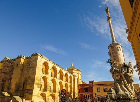 Mosque–Cathedral of Córdoba (Mezquita-Catedral) and \nStatue of San Rafael (Triunfo de San Rafael), Cordoba, Andalusia, Spain