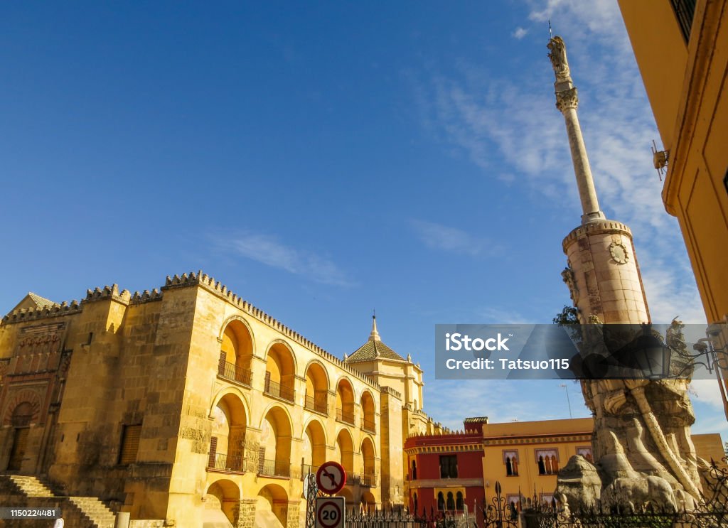 Mosque–Cathedral of Córdoba (Mezquita-Catedral) and 
Statue of San Rafael (Triunfo de San Rafael), Cordoba, Andalusia, Spain Cordoba - Spain Stock Photo
