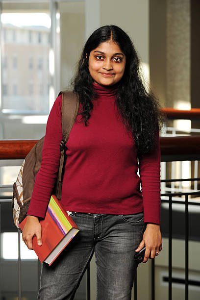 istock Young Eastern Woman Holding a Book 115022466