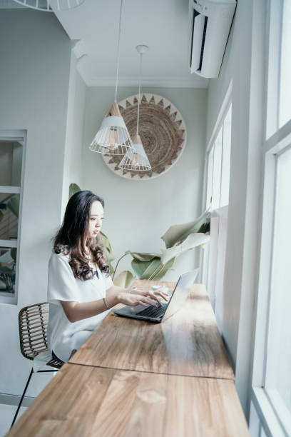 istock asian woman enjoy while working herself in cafe 1150226060