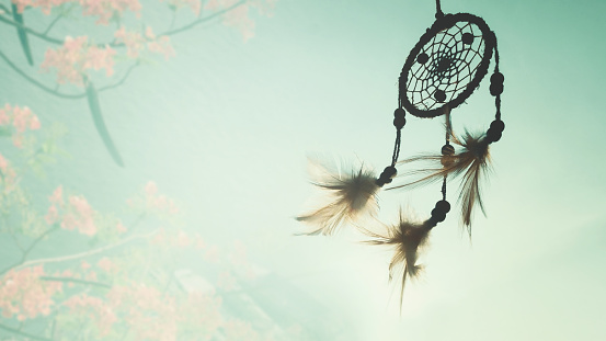 Dream catcher native american in the wind and blurred bright light background, hope and dream concepts